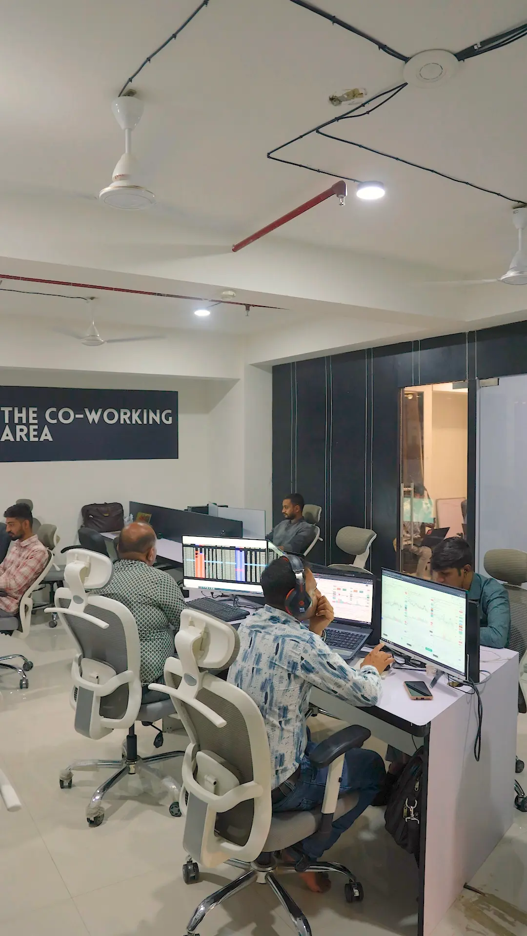 Coworking desks with comfortable chairs in Rajkot